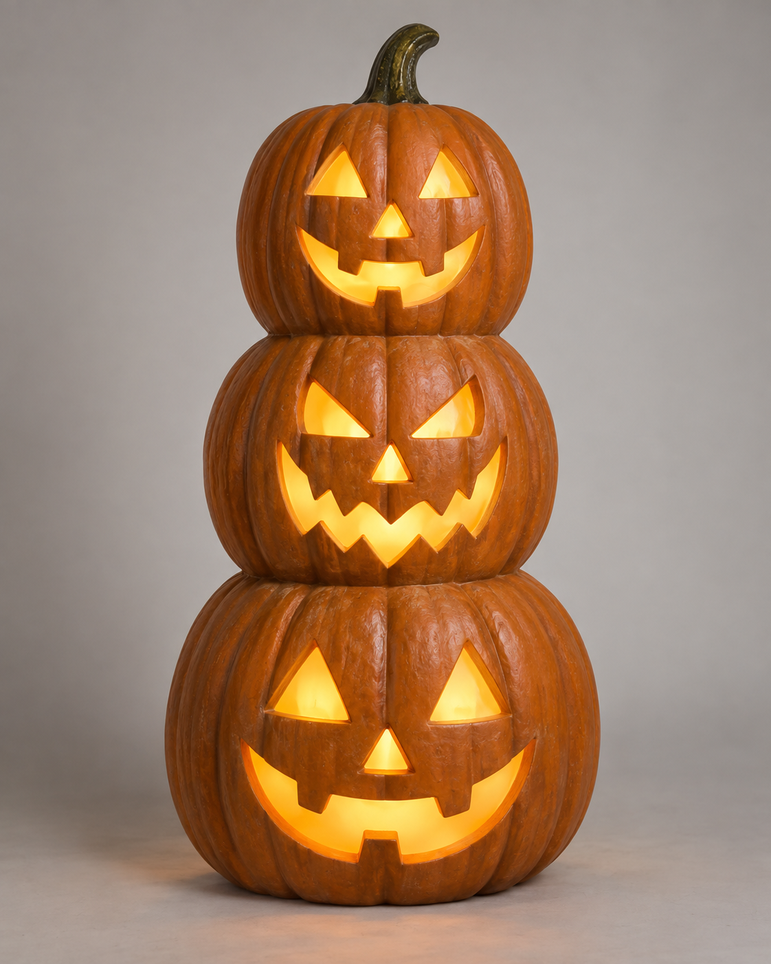 Illuminated jack-o-lantern stack Halloween display in a studio catalogue photograph